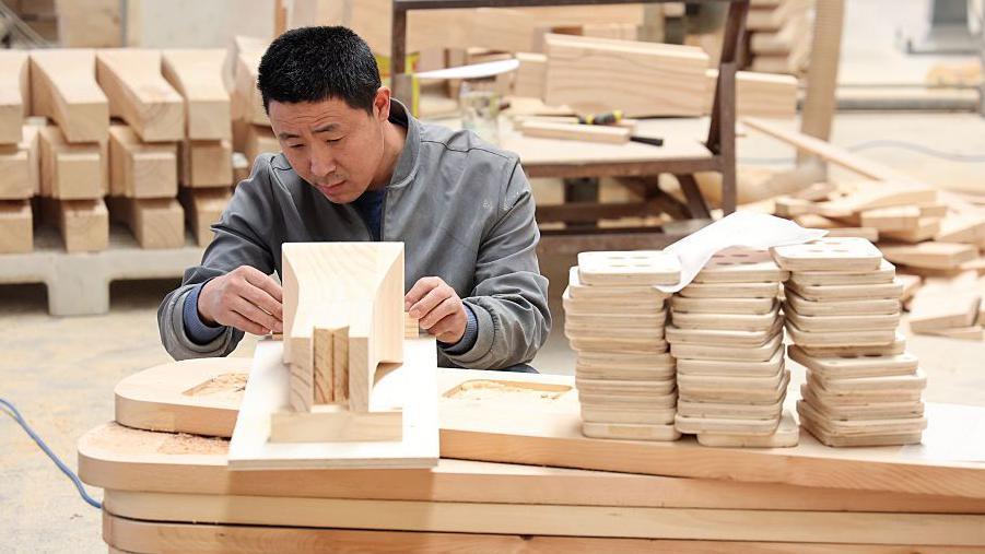 Craftsman working on wood